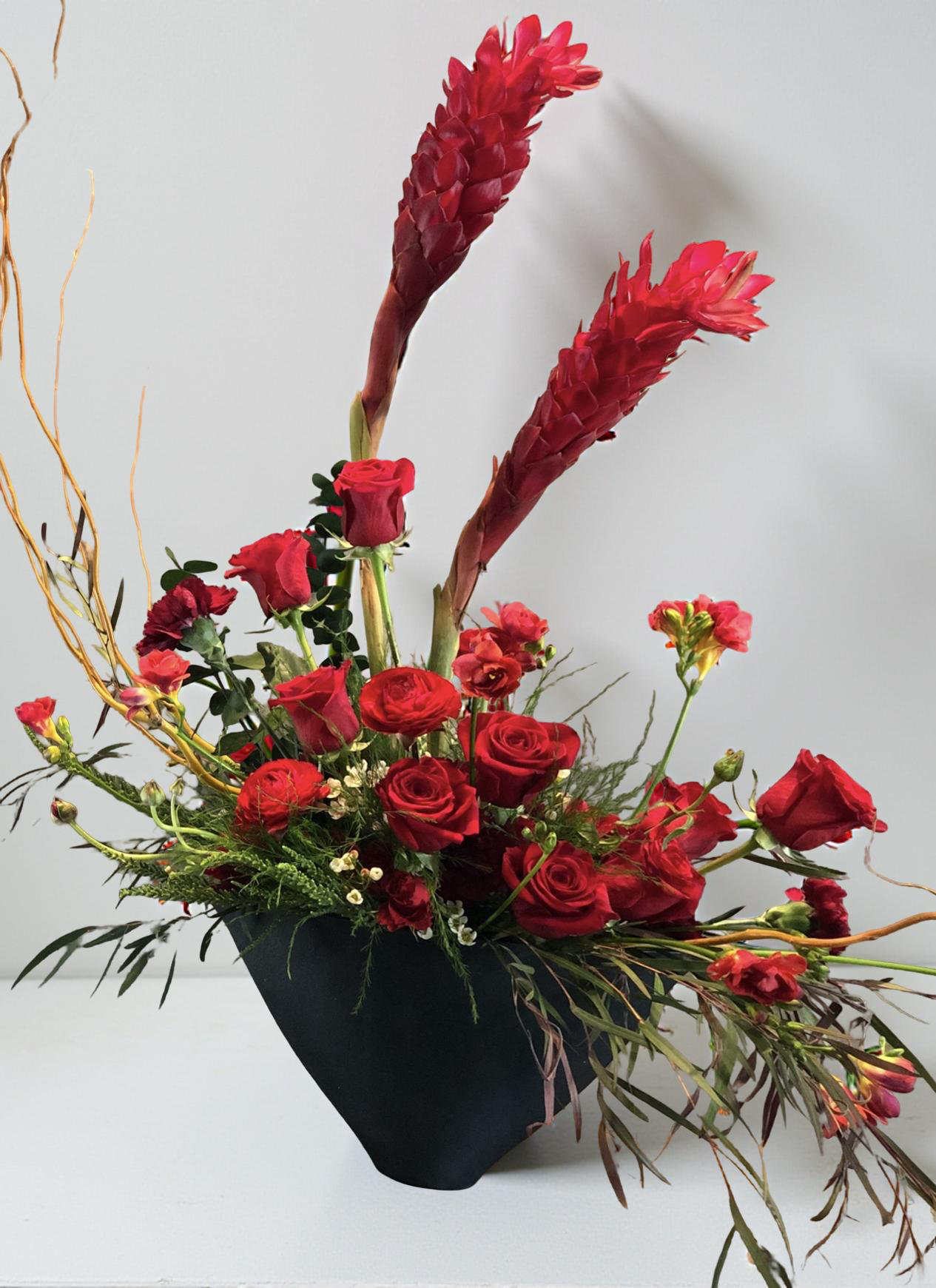 “Crimson Echo” – Sculptural Red Flower Arrangement in Handmade Vase