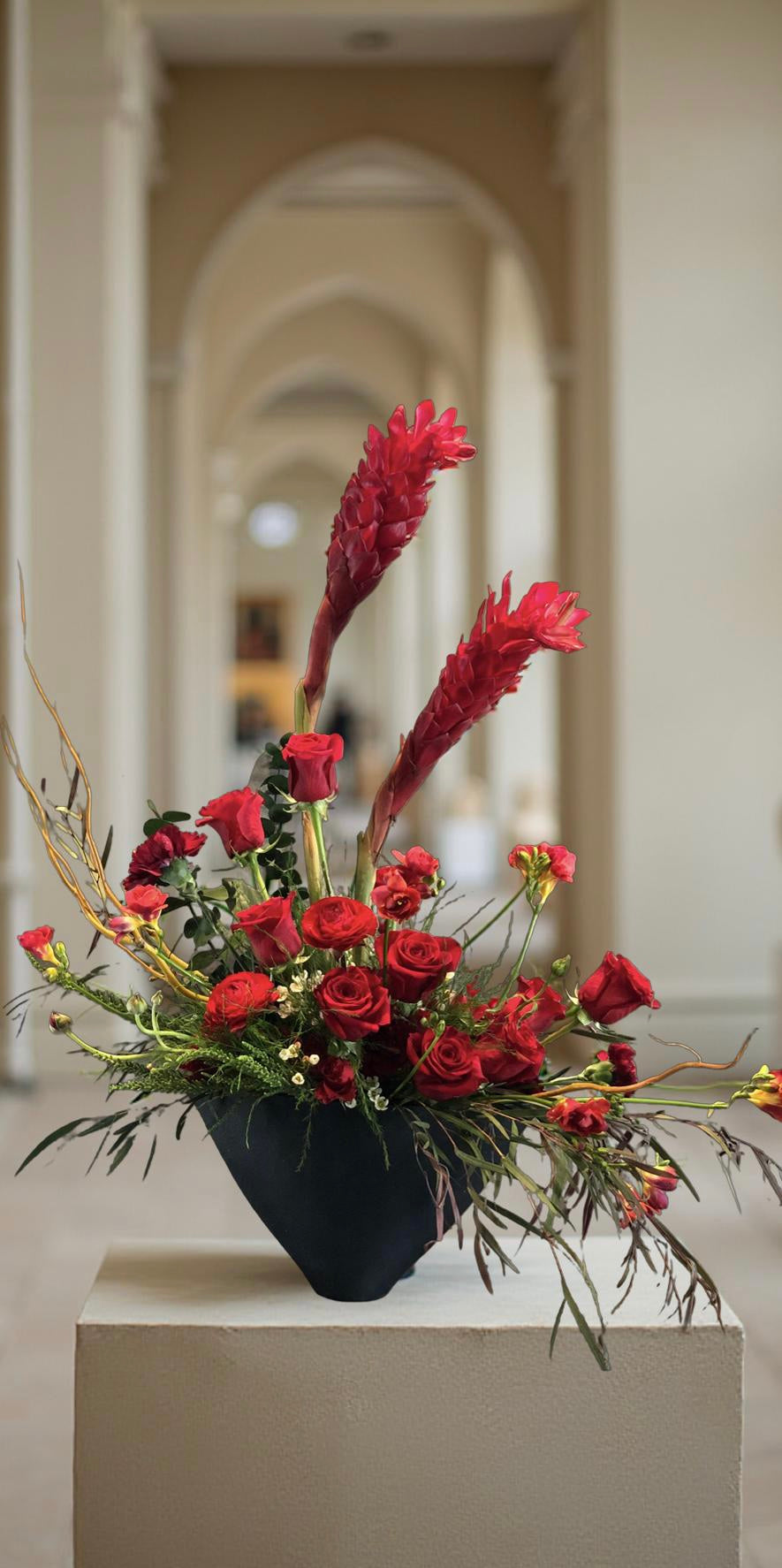 “Crimson Echo” – Sculptural Red Flower Arrangement in Handmade Vase