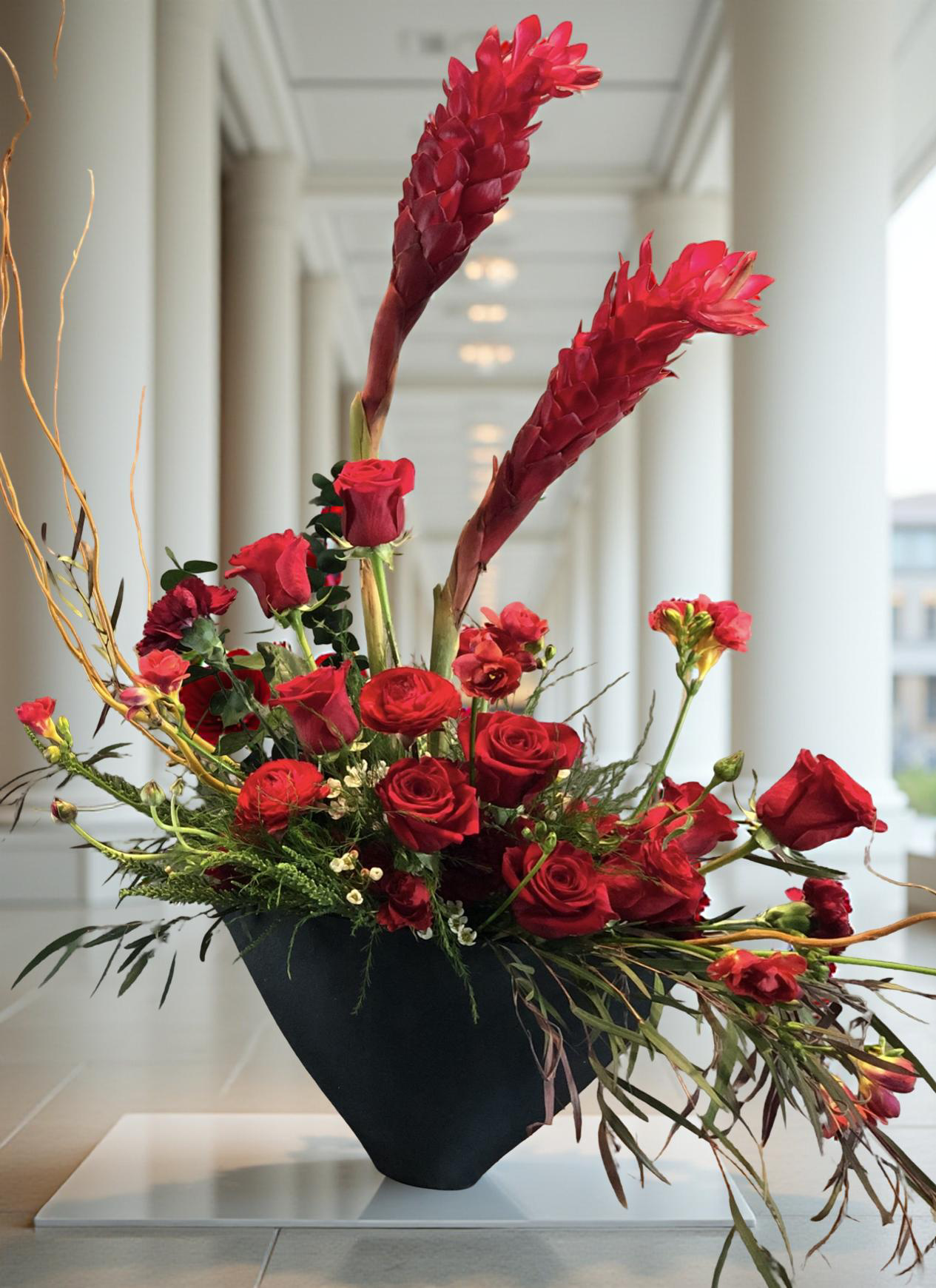 “Crimson Echo” – Sculptural Red Flower Arrangement in Handmade Vase